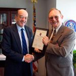 John Jackman presents award to FCC commissioner Michael Copps for working to preserve diversity in media.